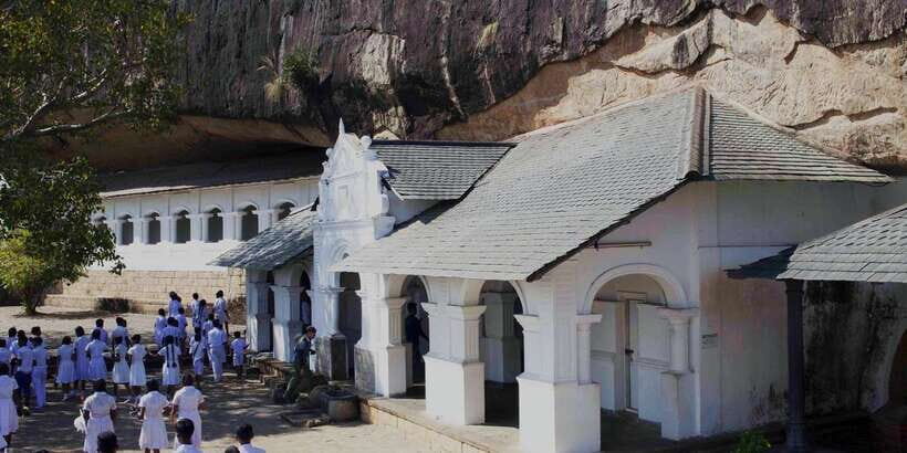 Dambulla: Cave Temple and Village All-Inclusive Tour - Entering the Dambulla Royal Cave Temple and Golden Temple
