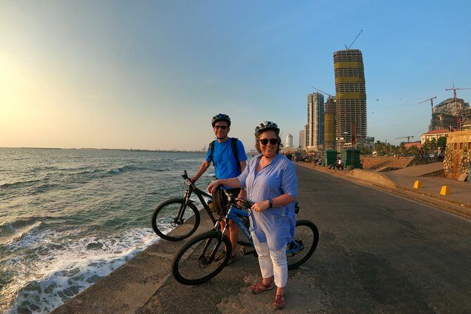 Luxury Night Cycle Tour of Colombo - Galle Face Green at dusk: Dutch cannon logic, kites, strollers, and sea air