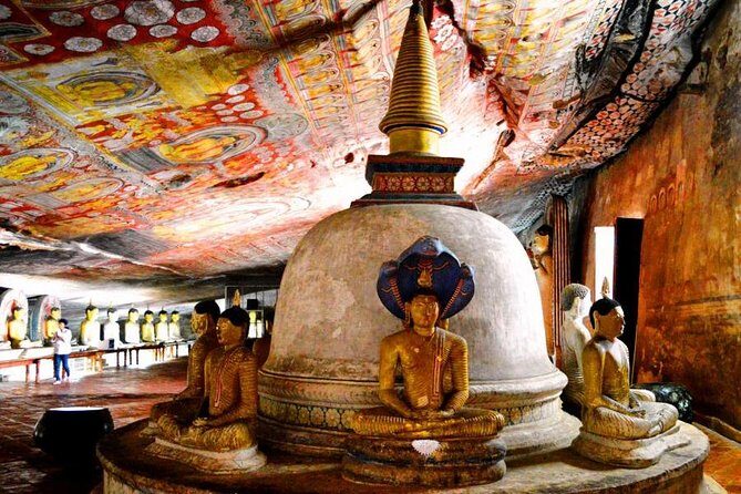 Sigiriya & Dambulla Private Day Trip with Entry Fees & Lunch - Stop 2: Dambulla Cave Temple art, statues, and cave shrines